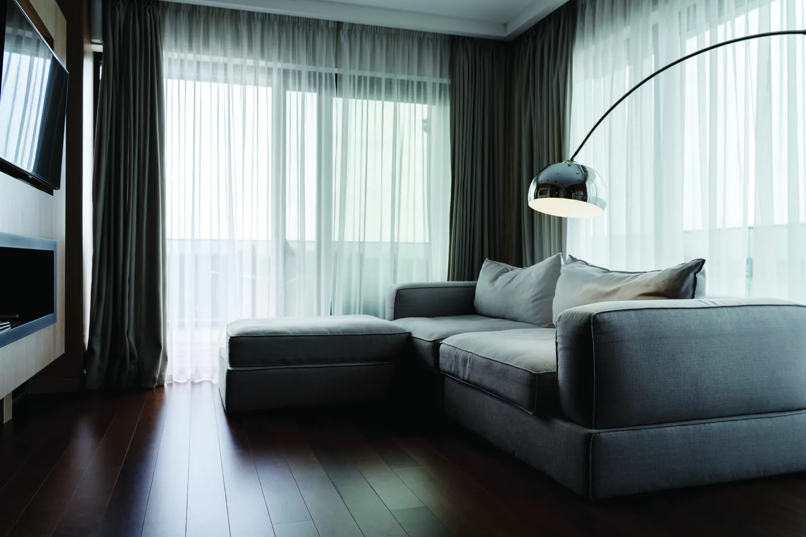 A quiet room with soft daylight through sheer curtains